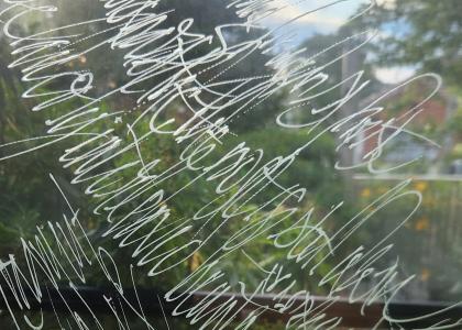calligraphy drawing on glass