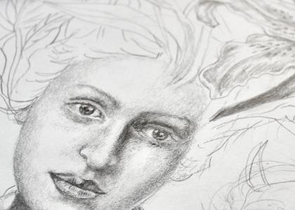 A close up of a detailed drawing of a figures face. 